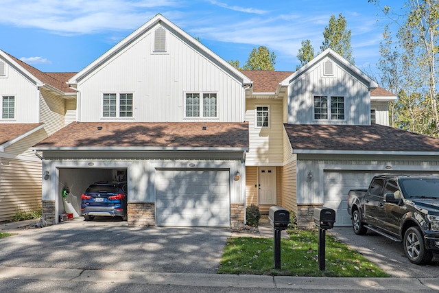 townhome / multi-family property featuring a garage