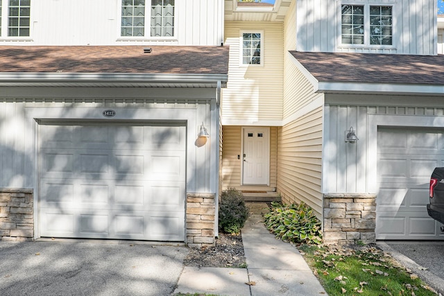 doorway to property featuring a garage