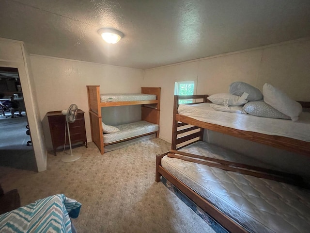 carpeted bedroom with a textured ceiling