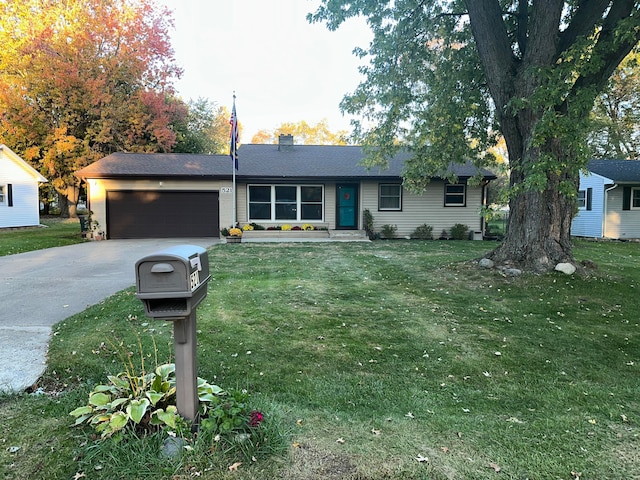 ranch-style house featuring a front lawn and a garage