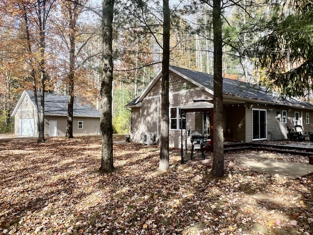 view of front facade with an outbuilding and a garage