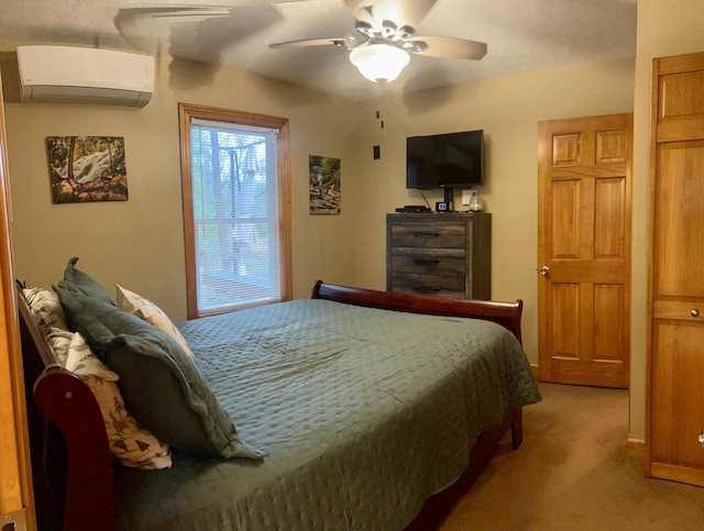 bedroom featuring carpet floors, a wall unit AC, and ceiling fan