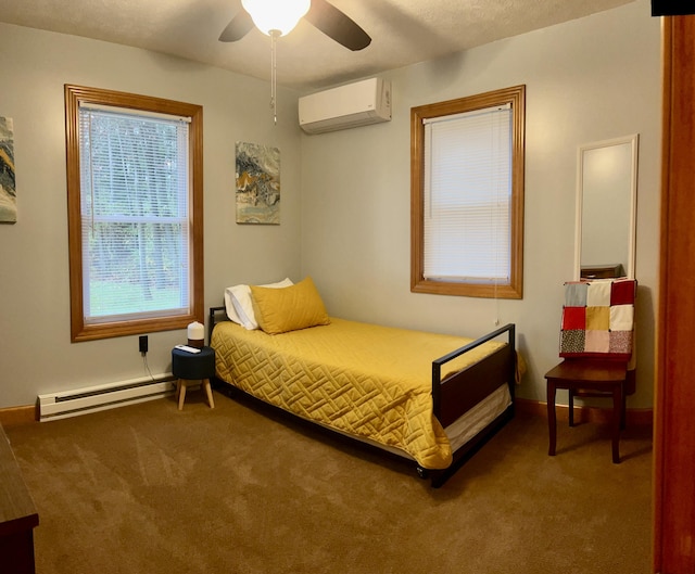 carpeted bedroom with a wall unit AC, ceiling fan, and a baseboard radiator