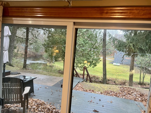 doorway to outside featuring a water view