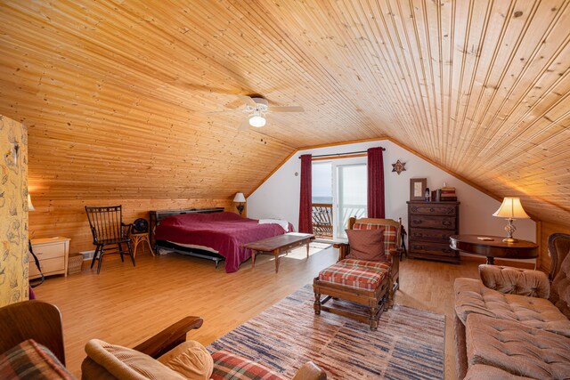 bedroom with wooden ceiling, lofted ceiling, ceiling fan, wooden walls, and hardwood / wood-style floors