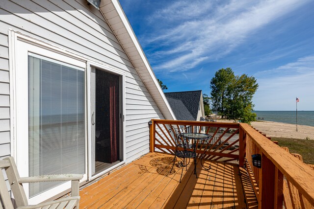 wooden deck featuring a water view