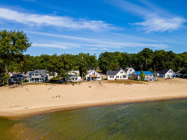 aerial view with a view of the beach and a water view