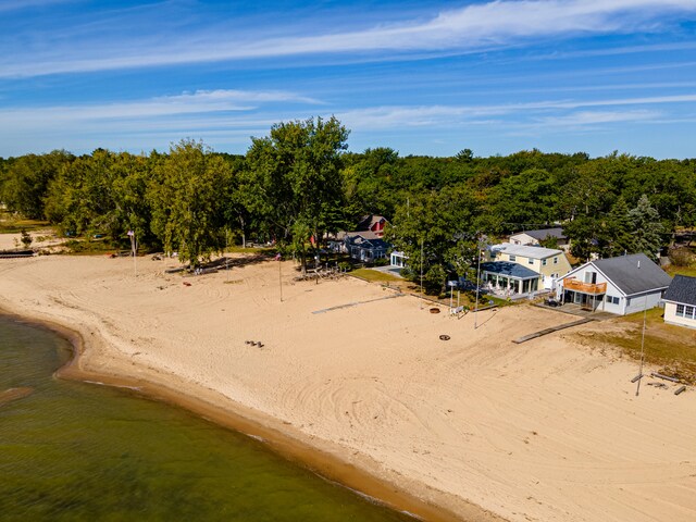 bird's eye view with a beach view and a water view