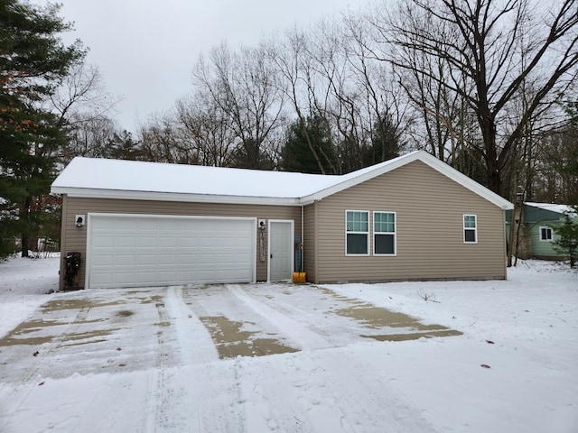 ranch-style house featuring a garage