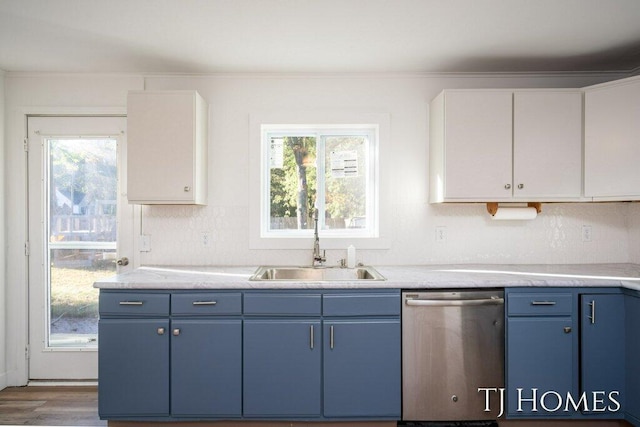 kitchen featuring blue cabinetry, white cabinets, dishwasher, and hardwood / wood-style flooring