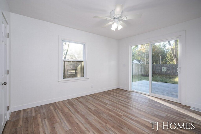 spare room featuring ceiling fan and hardwood / wood-style flooring