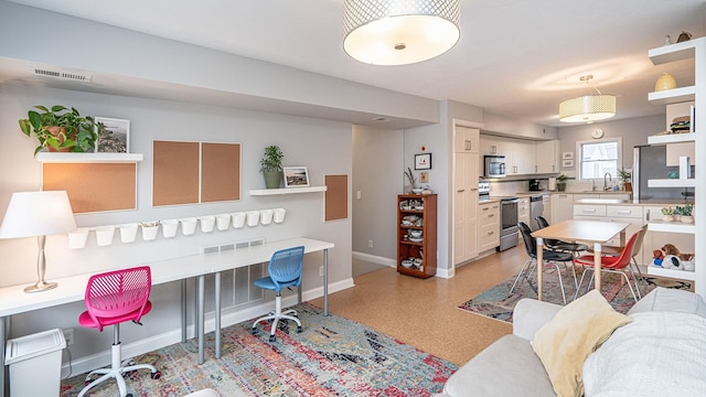 home office with sink and built in desk