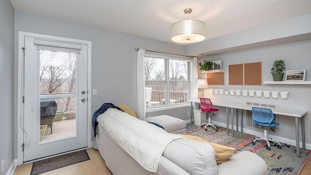 living room with plenty of natural light and built in desk