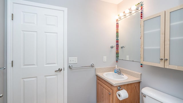 bathroom with toilet and vanity