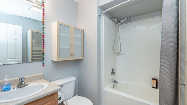 full bathroom featuring shower / bath combo with shower curtain, vanity, and toilet