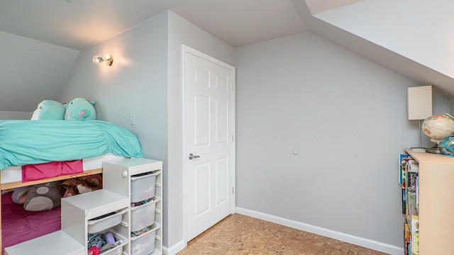 bedroom with lofted ceiling