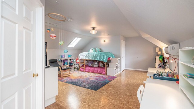 bedroom with lofted ceiling with skylight