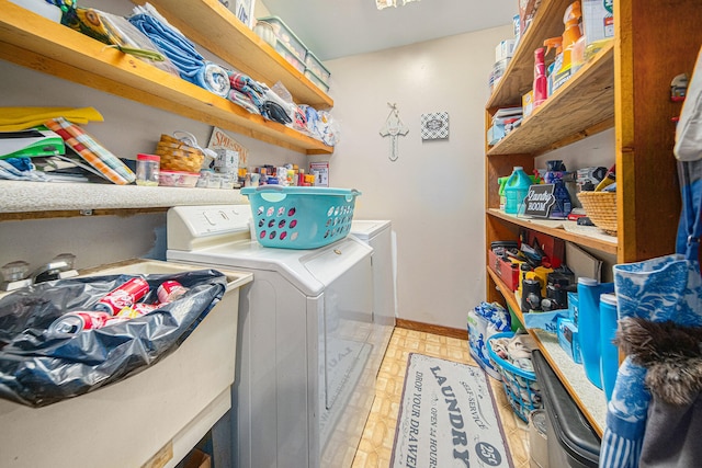 laundry area featuring sink and washing machine and clothes dryer