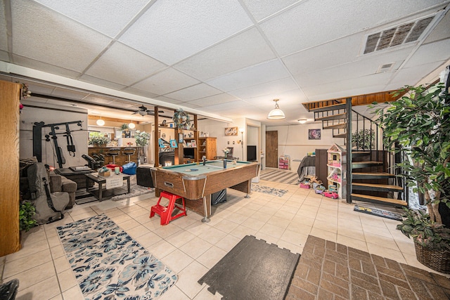 playroom featuring a paneled ceiling, billiards, and light tile patterned floors