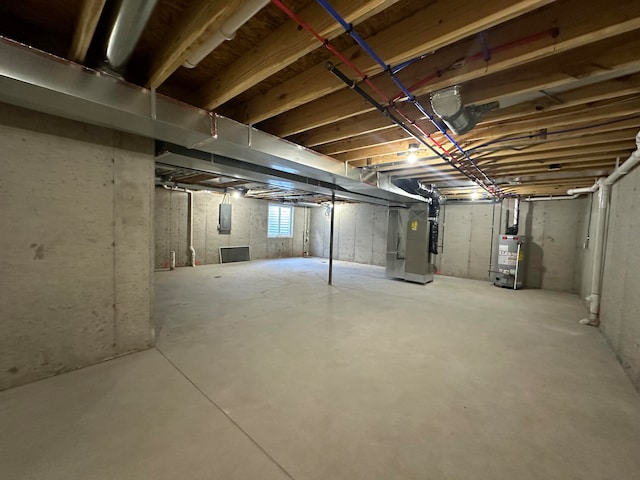 basement with gas water heater and heating unit