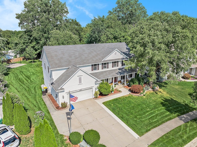 view of front of home featuring a garage and a front lawn