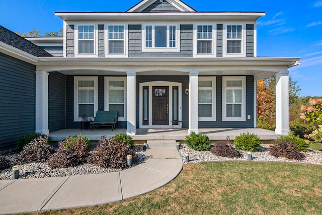 view of front of home featuring a front lawn and a porch