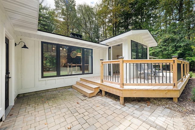 wooden deck with a patio area