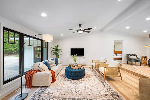 living room with wood-type flooring, vaulted ceiling with beams, and ceiling fan