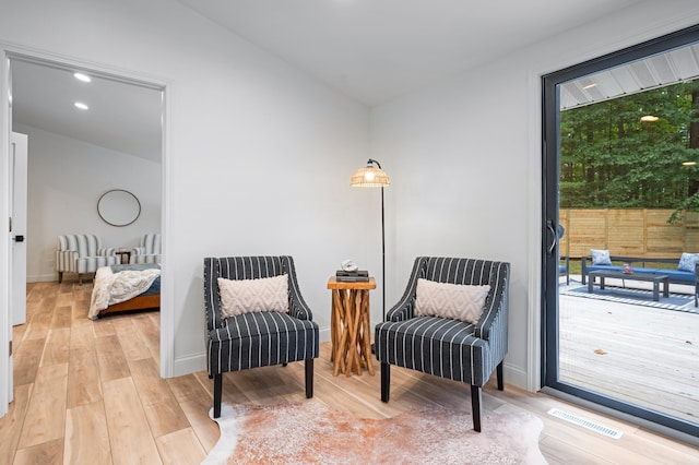 living area featuring light hardwood / wood-style flooring and a wealth of natural light