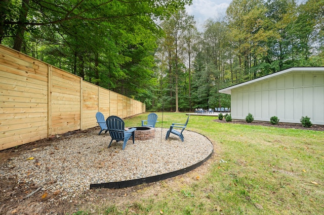 view of yard with an outdoor fire pit