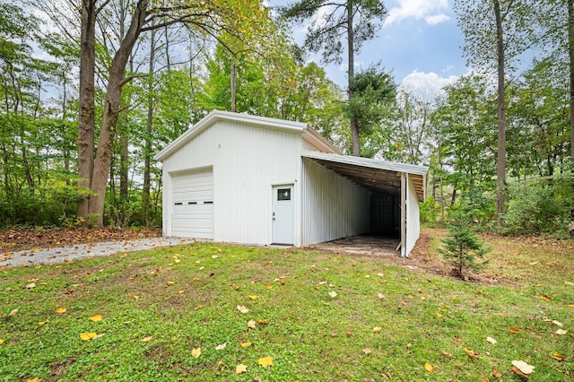 garage with a lawn and wood walls