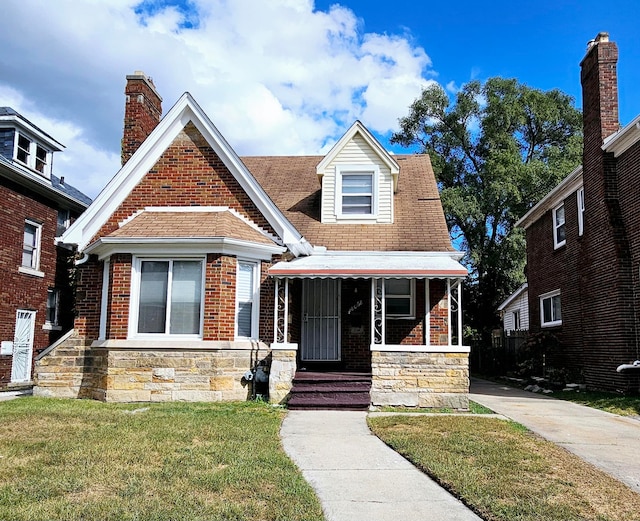 view of front of home featuring a front lawn and a porch