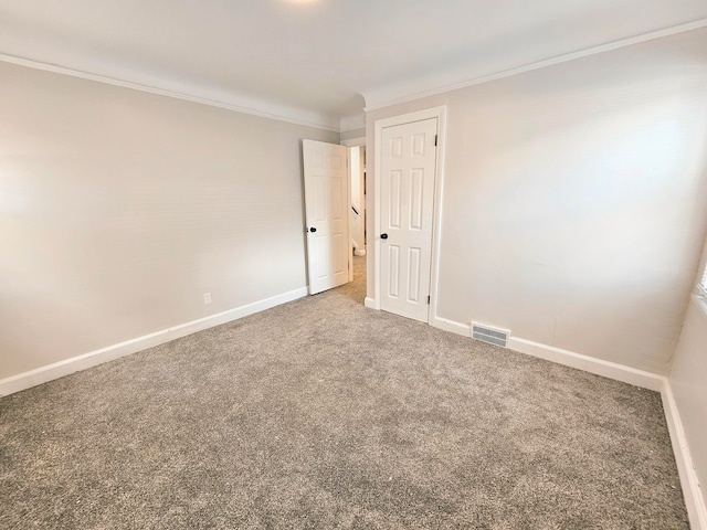 carpeted empty room with ornamental molding