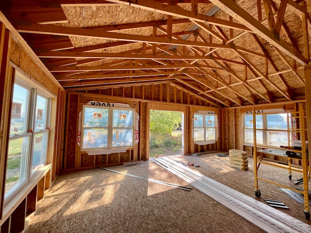 unfurnished sunroom with lofted ceiling and a wealth of natural light