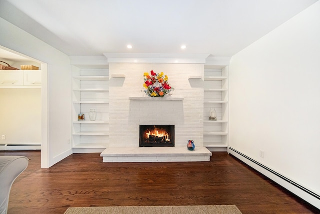 unfurnished living room featuring a fireplace, dark hardwood / wood-style flooring, and baseboard heating