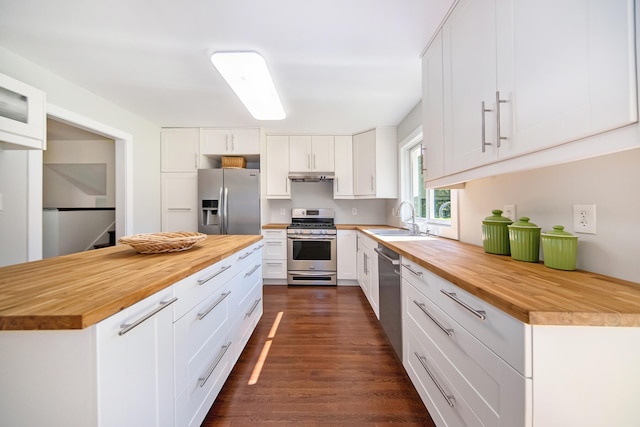 kitchen featuring white cabinetry, sink, appliances with stainless steel finishes, and wooden counters