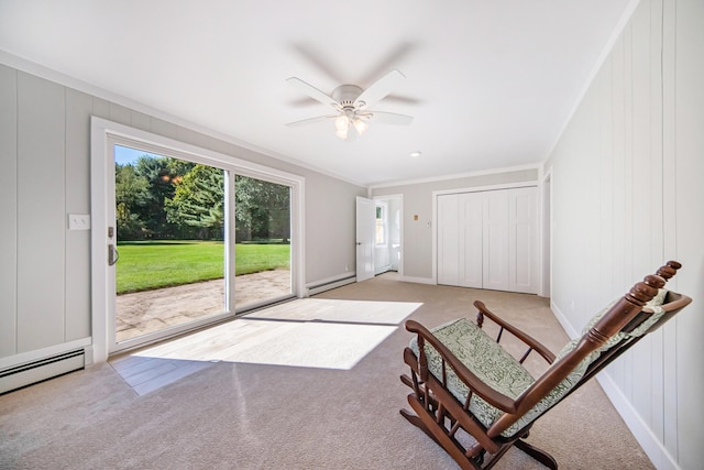 sitting room featuring ceiling fan, ornamental molding, light carpet, and a baseboard heating unit