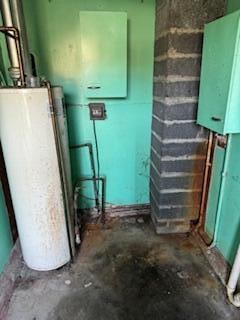 utility room with water heater