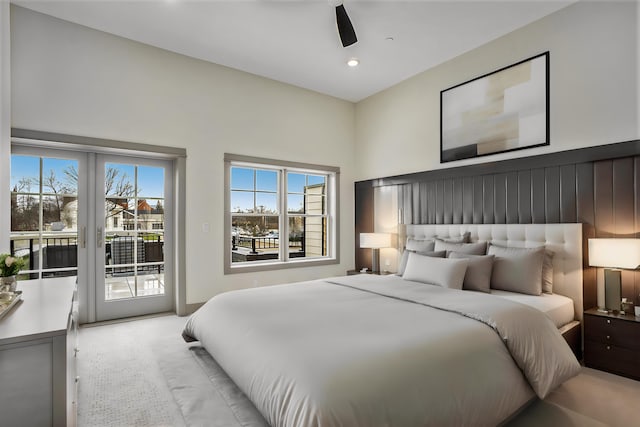 carpeted bedroom featuring access to outside and ceiling fan