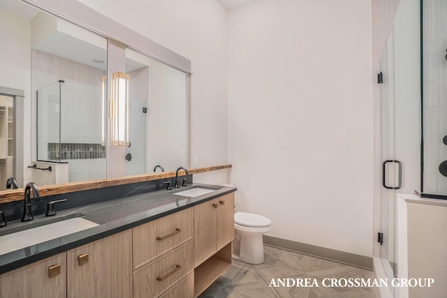 bathroom featuring vanity, walk in shower, and toilet