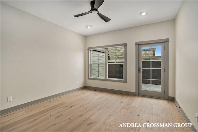 unfurnished room with light hardwood / wood-style flooring and ceiling fan