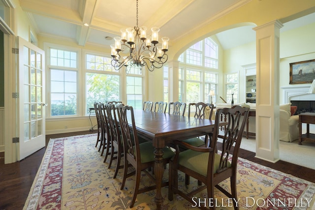 dining room with ornate columns, beamed ceiling, dark hardwood / wood-style floors, crown molding, and coffered ceiling