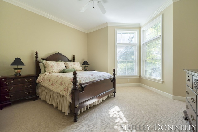 carpeted bedroom with crown molding and ceiling fan