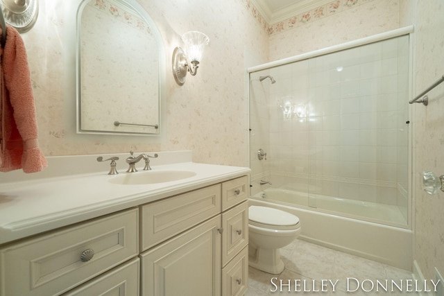 full bathroom featuring tile patterned floors, vanity, toilet, combined bath / shower with glass door, and crown molding