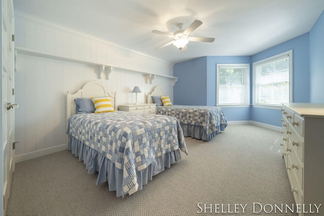 bedroom featuring light colored carpet and ceiling fan