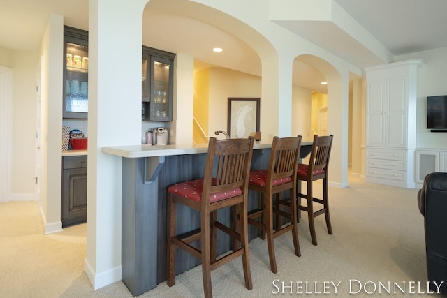 bar featuring light colored carpet