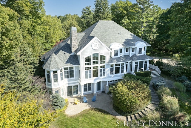 back of property featuring a wooden deck