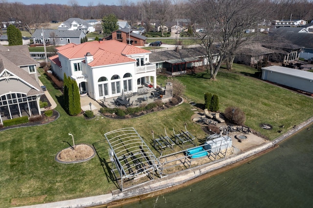 drone / aerial view with a water view