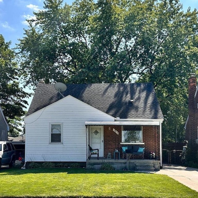 bungalow-style house with a porch and a front yard