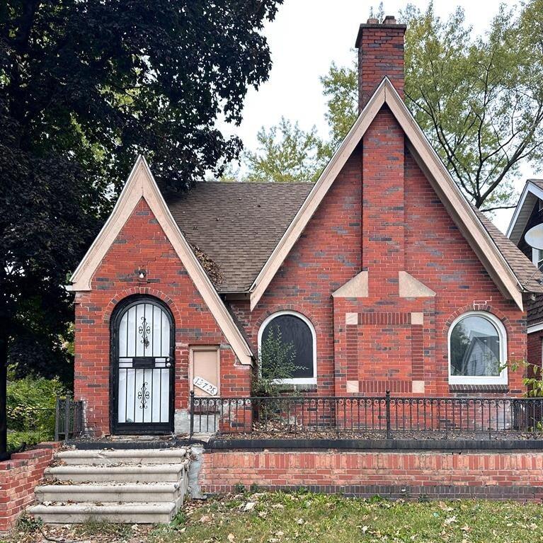 13726 Wadsworth St, Detroit, MI 48227 - tudor-style house featuring brick siding, a chimney, and roof with shingles